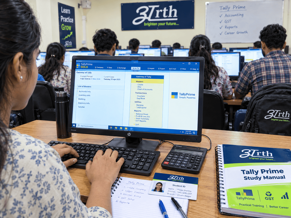 Close-up of a student practicing Tally Prime entries and ledger creation on a lab computer with their Arth study manual and notebooks.